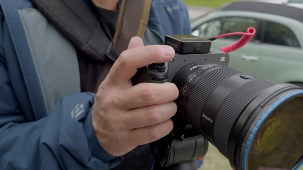 Sony FX2 Launches with Hybrid Power: Is It the Ultimate Budget Cinema Camera? 3 Filmmaker using Sony FX2 camera in bright daylight